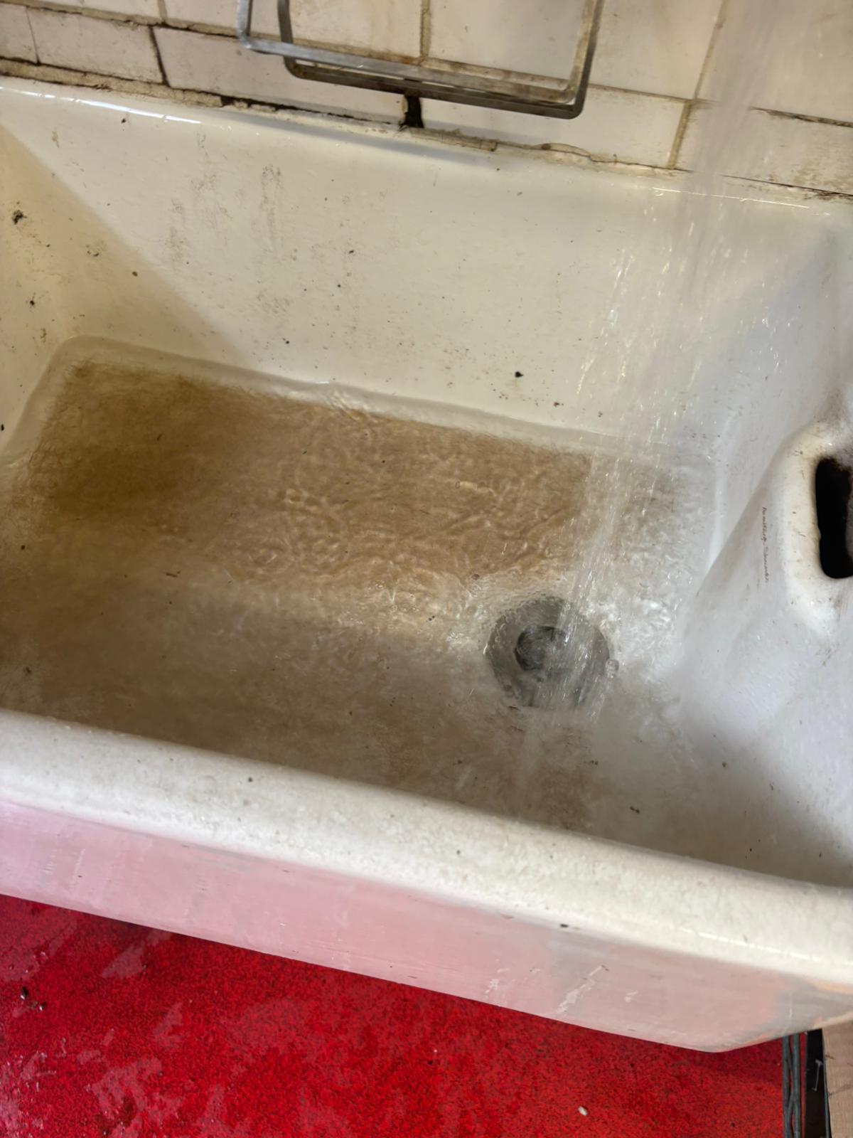 The same sink waste pipe flowing freely after clearance