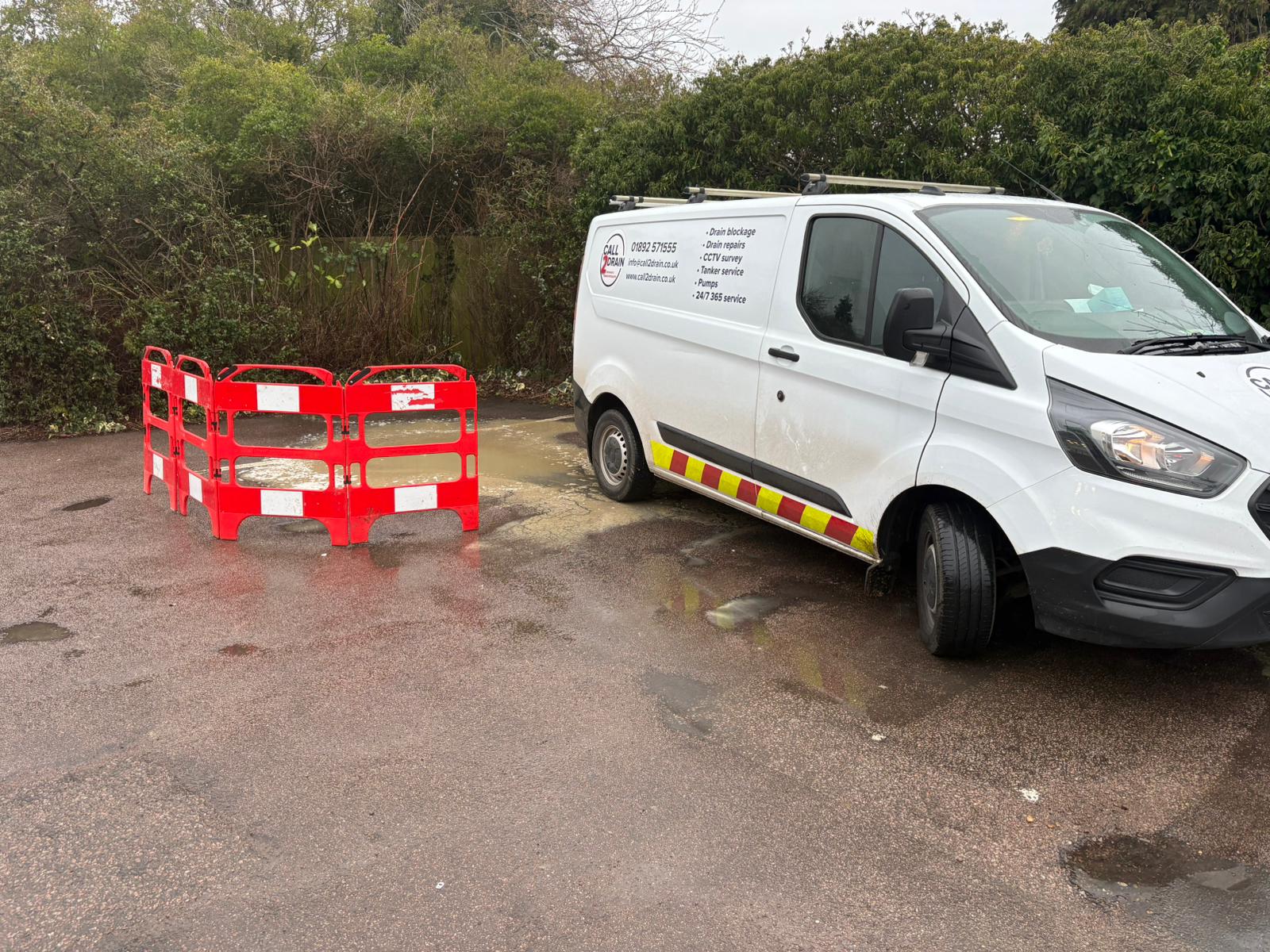 Call2Drain tanker and safety barriers at a flooded car park emergency in Kent, Surrey, Sussex, Essex & London