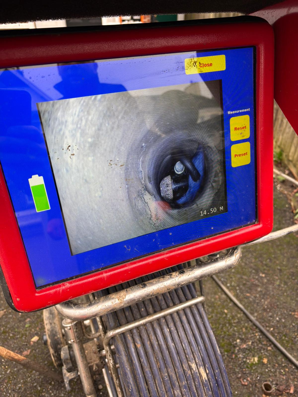 CCTV drain survey monitor showing the inside of a pipe during a fault-finding visit in Kent, Surrey, Sussex, Essex & London