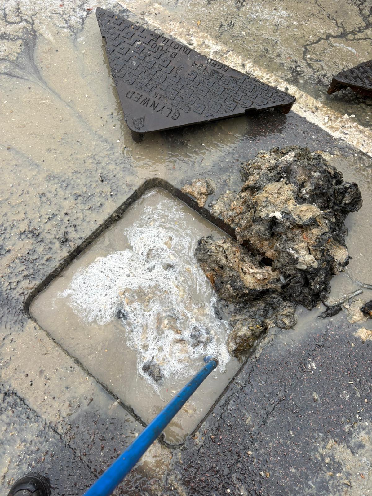 Blockage ejected from a street manhole during high-pressure jetting in Kent, Surrey, Sussex, Essex & London