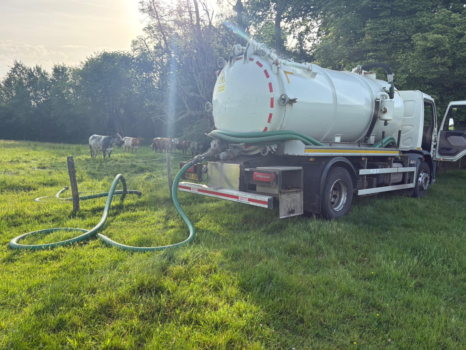 Vacuum tanker emptying a septic tank at a rural farm in Kent, Surrey, Sussex, Essex & London